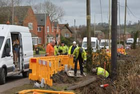 Workers survey the problem after 400 homes lost their internet access.
PICTURE: ANDREW CARPENTER