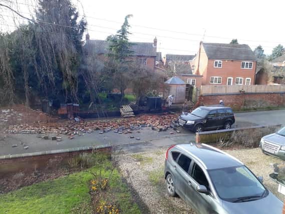 An entire community immediately banded together to clear a road of hundreds of broken bricks in a village near Market Harborough after a family’s six-foot high garden wall collapsed.