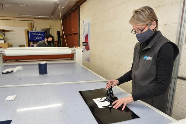 Kate Richens working at Jim Watts Signs.
PICTURE: ANDREW CARPENTER