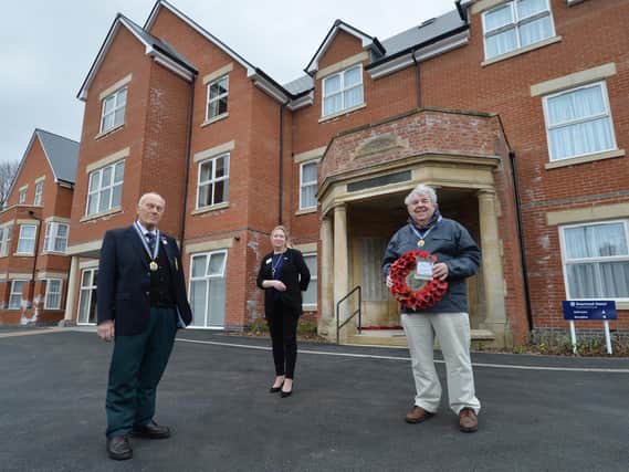 From left, Rev John Morley president, Susanne Stevens general manager and Stewart Harrison chairman outside the Rosewood Manor with the portico included in the project.
PICTURE: ANDREW CARPENTER