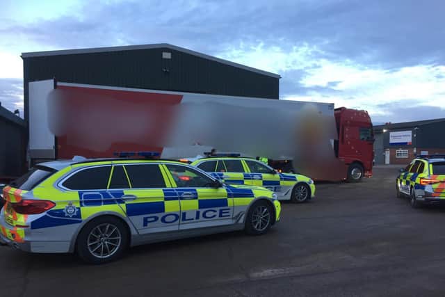 Three suspected illegal immigrants have been arrested in a Harborough district village after the lorry driver heard them talking in his trailer and alerted police.