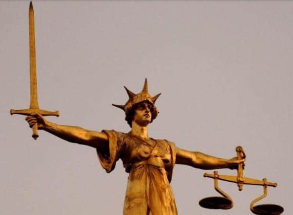 A woman is set to appear in court accused of swindling over £184,000 from a leading medical practice in a Harborough village.
