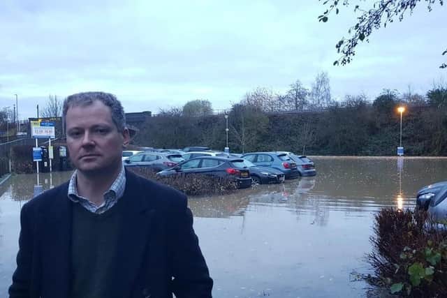 Neil O'Brien MP at the flooded car park.