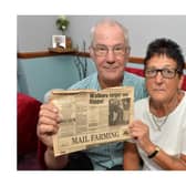 Carole Tilley with her husband Allan, holding an old story about the Hippo Appeal.