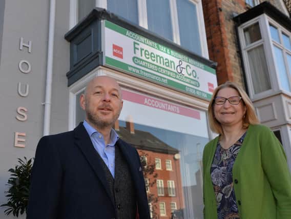 Jonathan and Ruth Freeman outside Freeman and Co's new office in St Mary's Road, Market Harborough.