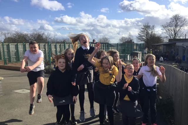 Chilldren celebrate their return to Ridgeway Primary Academy.
