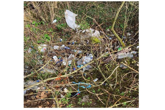 Litter pickers have removed an astonishing 48 big bags of rubbish - including 40 bottles of urine - dumped in a layby on the edge of Market Harborough.