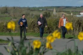 From left, Harry Hollis, Phil Allan chairman and Steve Wickham head towards the bottle kicking battlefield.
PICTURE: ANDREW CARPENTER