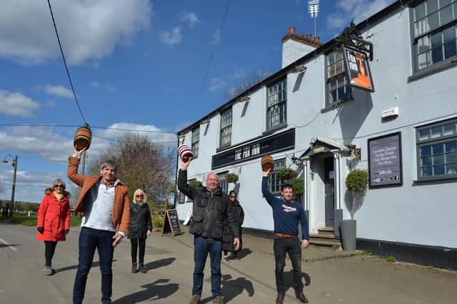 From left, Steve Wickham, Phil Allan chairman and Harry Hollis set off from the Fox pub in Hallaton on Easter Monday
PICTURE: ANDREW CARPENTER