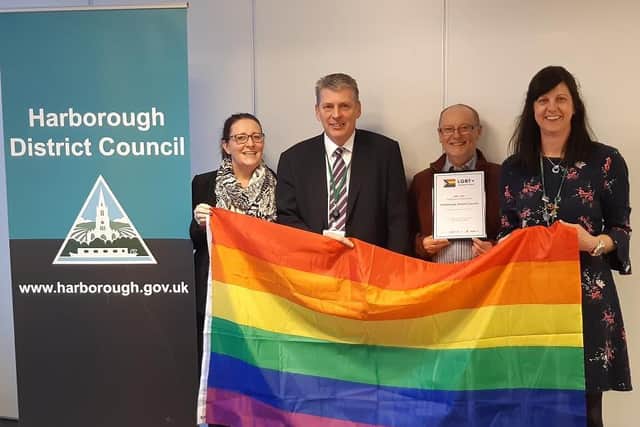 Harborough District Council representatives with the rainbow flag: Rachael Felts customer services and engagement manager, Norman Proudfoot joint chief executive, Cllr Paul Dann, and Julie Clarke equality and diversity officer