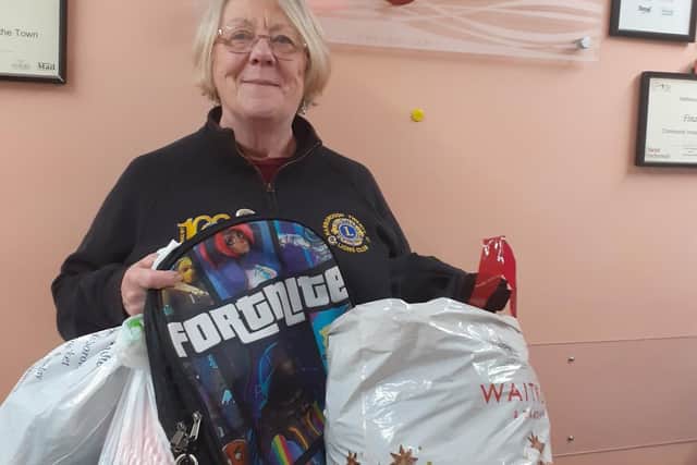 Lions member Lesley Croft with some of the donations.
