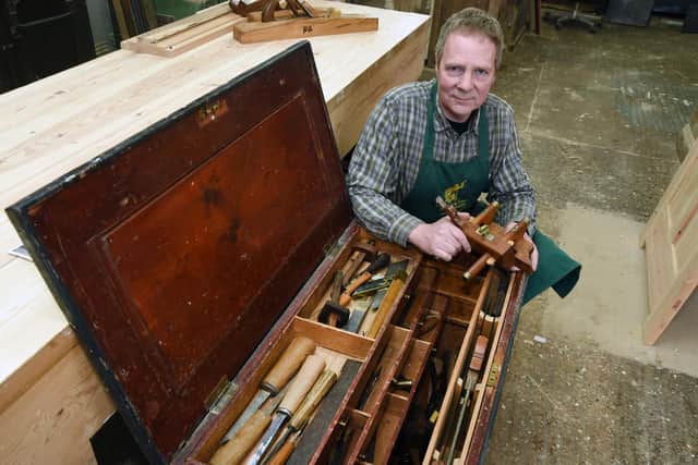 Richard with his grandfathers tool box he now uses everyday.
PICTURE: ANDREW CARPENTER