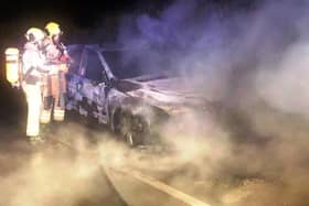 Firefighters from Desborough raced to tackle the blazing car in the pitch black darkness while Leicestershire Police closed the road.