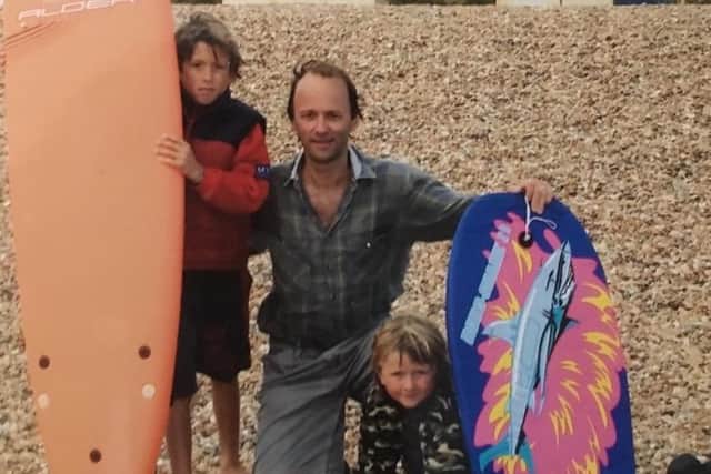 Hylton with his boys at the beach  Jim on left; Luke on right