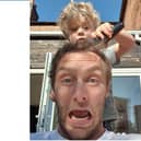 Nick Bradley gets his hair cut by his four-year-old son.