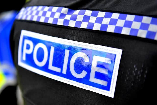 A man is being questioned on suspicion of attempted murder after a petrol bomb was apparently hurled at a caravan on a Desborough travellers site.