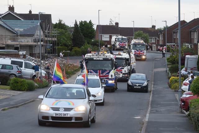 Residents on Ridgeway West clap the convoy which has nearly raised 1,000.
PICTURE: ANDREW CARPENTER