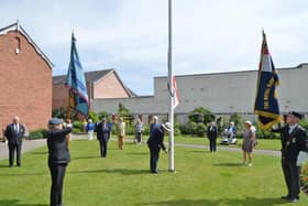 Rev John Morley raises the Armed Forces Flag in the Memorial Gardens.
PICTURE: ANDREW CARPENTER