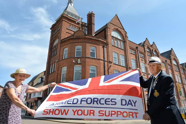 Jill Mann vice chairman and Rev John Morley outside Harborough District Council offices with the Armed Forces flag.
PICTURE: ANDREW CARPENTER