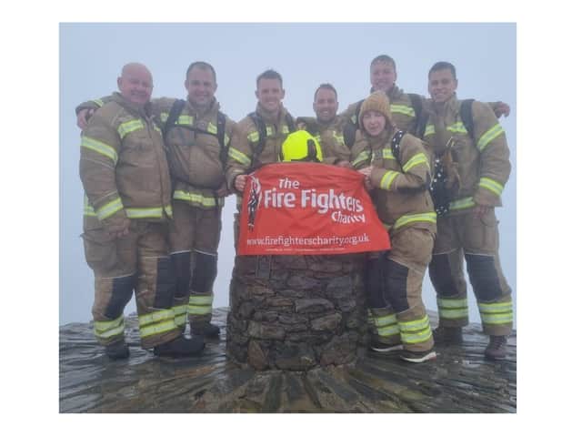 Firefighters from Kibworth have almost tripled their fundraising target for charity after climbing Mount Snowdon in their full kit.