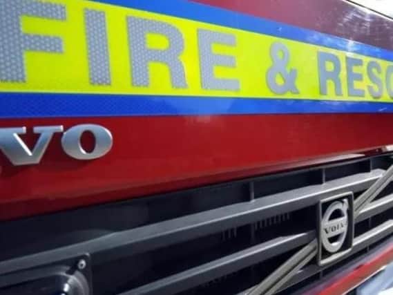 Two people escaped unhurt after a van suddenly burst into flames on a busy rush-hour road in Market Harborough.