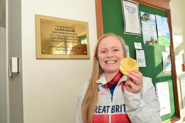 Laura Sugar unveils the plaque at the gold library box.
PICTURE: ANDREW CARPENTER