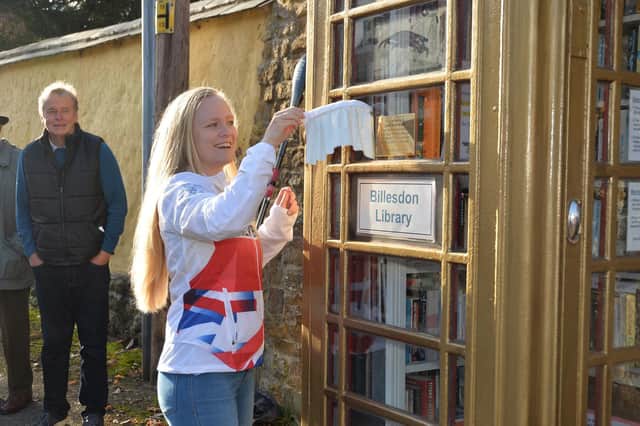 Laura Sugar unveils the plaque at the gold library box.
PICTURE: ANDREW CARPENTER