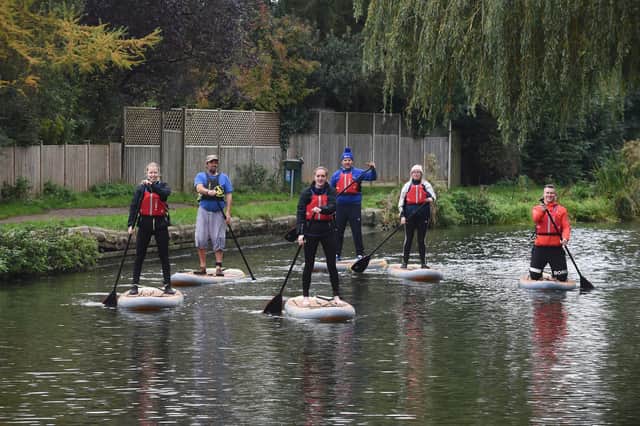 The paddle boaders on the union canal at Market Harborough.
PICTURE: ANDREW CARPENTER