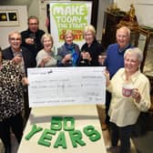 Karen Hancock and Kerry Davis hand over £350 from a recent Macmillan Coffee Morning at Gildings to the Market Harborough Macmillan committee members during their 50th anniversary AGM.
PICTURE: ANDREW CARPENTER