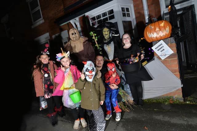 Gemma Fortnum dressed as a witch with members of her family during the Halloween house event on Highfield Street.
PICTURE: ANDREW CARPENTER