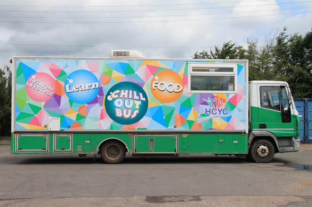 The group’s vehicle – dubbed the Chill Out Bus – is decked out in a striking multi-coloured livery designed by young people.