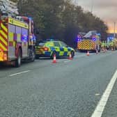 Firefighters raced to free an injured woman from her wrecked car after a three-vehicle crash on the A14.