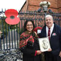 Stewart Harrison and Sheila Caberwal holding a picture of her late father Jagat Caberwal.
PICTURE: ANDREW CARPENTER