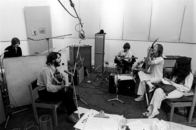 The Beatles are joined by Yoko Ono in rehearsals (photo: Ethan A. Russell)