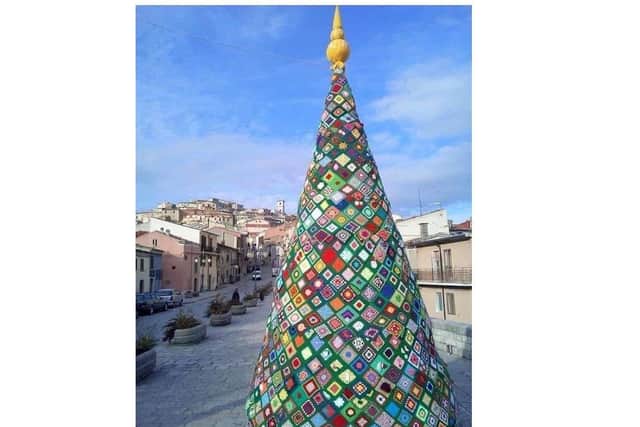 A tree in Trivento, Italy, made entirely of crocheted squares sewn together and draped over an enormous frame in the shape of a Christmas Tree. This was the inspiration for the tree in Harborough.