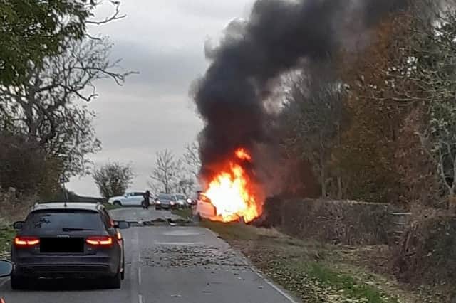 This dramatic pictures shows just how lucky a driver was to escape from his car yesterday (Thursday) after it exploded into a fireball near Market Harborough.