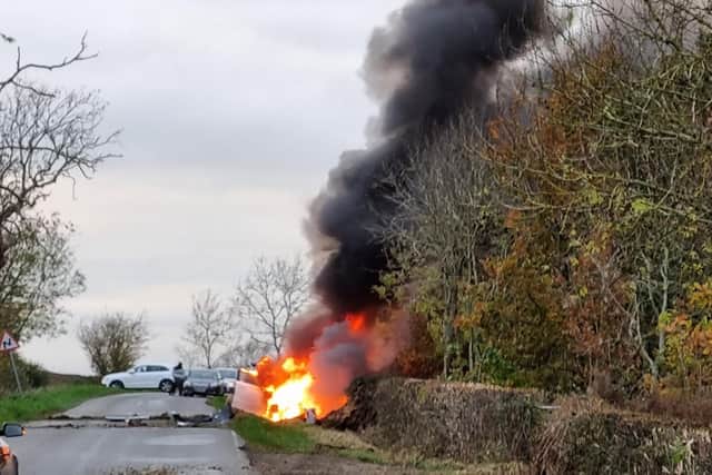 This dramatic pictures shows just how lucky a driver was to escape from his car yesterday (Thursday) after it exploded into a fireball near Market Harborough.