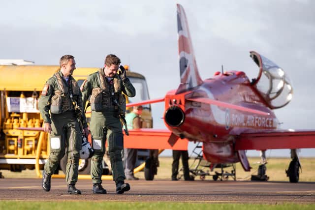 Flight Lieutenant Patrick Kershaw (right) with an existing Red Arrows pilot, following one of his first sorties with the team. Photo: MoDCrown Copyright 2021