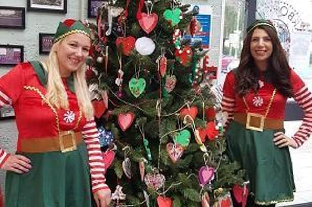 Chloe Goode, from Craft-I-Trims, who arranged the elf doors competition and the decoration of the market using customers handmade decorations, and Bridget Albano of Retail Genie.