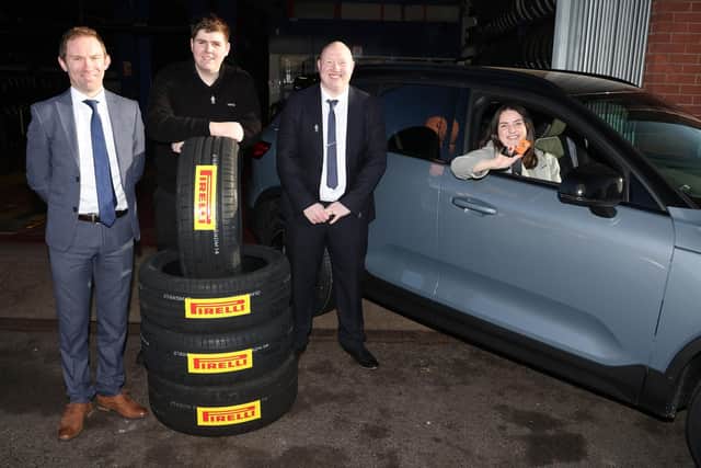 Scott Banks (Pirelli), Josh Colvin and Ben Clark of Kwik Fit, with Sarah Megan in her prize car