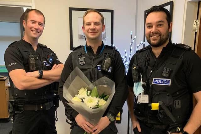 PC Steve Winn, PC Ryan Holden and PC James Day with flowers for the family