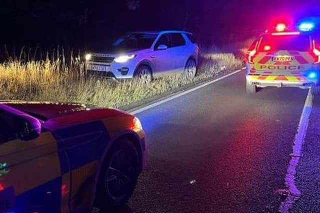 Police are hunting the reckless driver of a stolen Land Rover Discovery who sped the wrong way down a busy road before running off over fields towards Lutterworth.