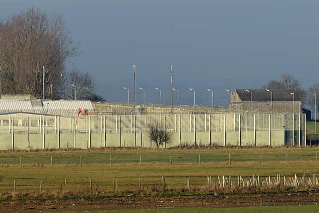 A digger can be seen working in prison grounds.
PICTURE: ANDREW CARPENTER