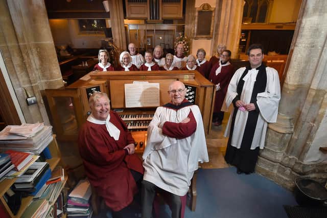 Barbara and David Johnson with Rev Barry Hill and members of the Dionysius Church Choir.
PICTURE: ANDREW CARPENTER