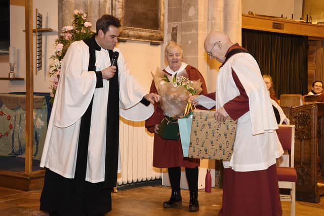 Rev Barry Hill presents gifts to Barbara and David Johnson after the service.
PICTURE: ANDREW CARPENTER