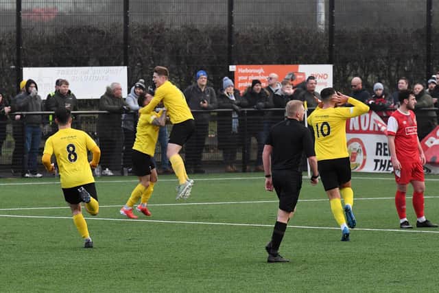Josh Walsh celebrates after he scored a free-kick for Harborough in their FA Vase clash