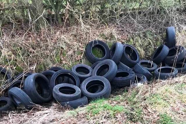 Fly-tippers have dumped over 30 worn-out tyres on the edge of Market Harborough.