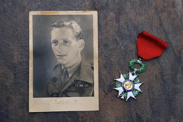Albert Tregoning pictured in Germany aged 21 in 1945 and his French order, Chevalier de la Legion D'honneur.
PICTURE: ANDREW CARPENTER