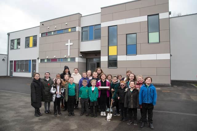 Fleckney Primary school children with year 4 teacher Medina Wright outside the new building.
PICTURE: ANDREW CARPENTER