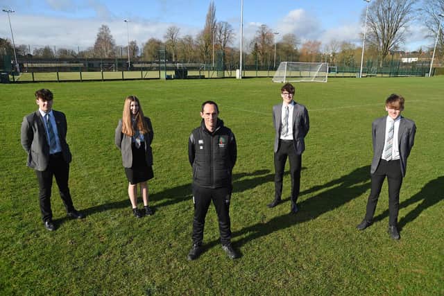 Pictured on the proposed sports hall at Welland Park School from left, Harry, Thea, PE teacher Jason Button, Ollie and Zack.
PICTURE: ANDREW CARPENTER